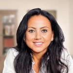 Smiling woman, books in background